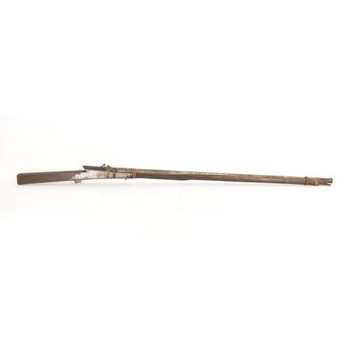 193 - A 19th century Indian toradar matchlock musket, the long steel barrel secured by an iron barrel band... 