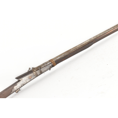 193 - A 19th century Indian toradar matchlock musket, the long steel barrel secured by an iron barrel band... 