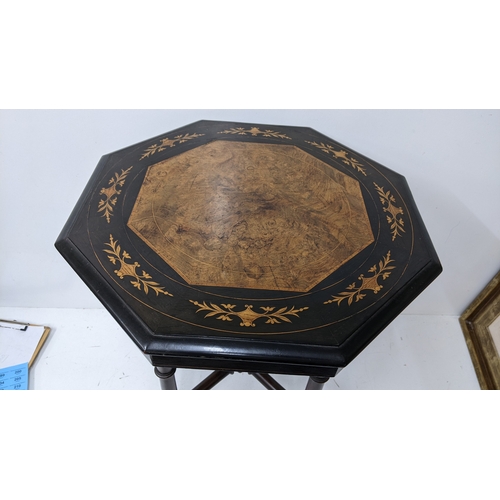194 - A Victorian Aesthetic Movement ebonised and burr walnut occasional table, the octagonal burr walnut ... 