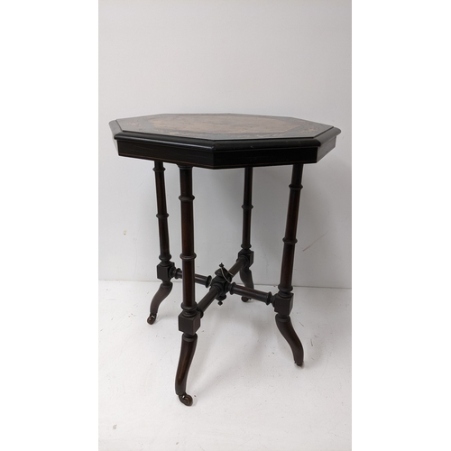 194 - A Victorian Aesthetic Movement ebonised and burr walnut occasional table, the octagonal burr walnut ... 