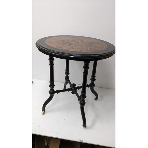 195 - A Victorian Aesthetic Movement ebonised and burr walnut circular occasional table, the circular top ... 