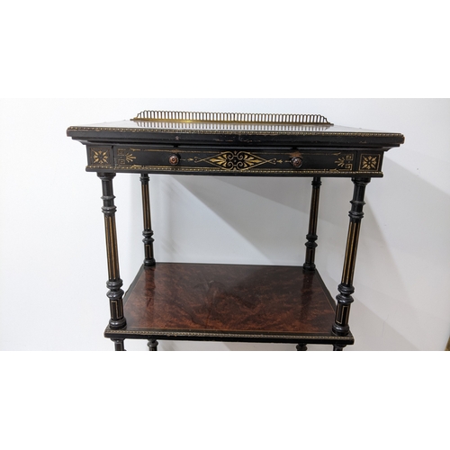 196 - A Gillows Victorian Aesthetic Movement ebonised and amboyna whatnot, the rectangular three-tier top ... 