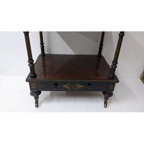 196 - A Gillows Victorian Aesthetic Movement ebonised and amboyna whatnot, the rectangular three-tier top ... 