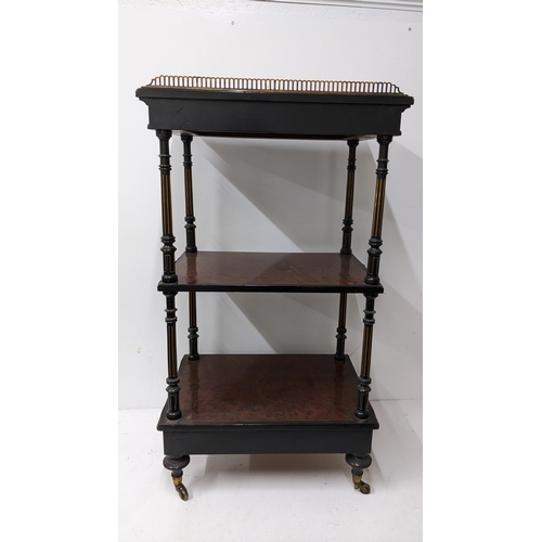 196 - A Gillows Victorian Aesthetic Movement ebonised and amboyna whatnot, the rectangular three-tier top ... 