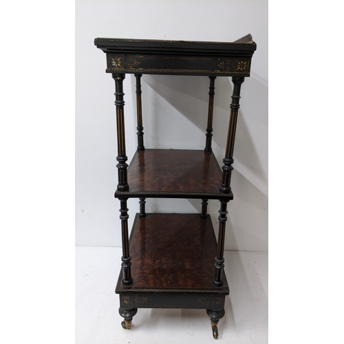 196 - A Gillows Victorian Aesthetic Movement ebonised and amboyna whatnot, the rectangular three-tier top ... 