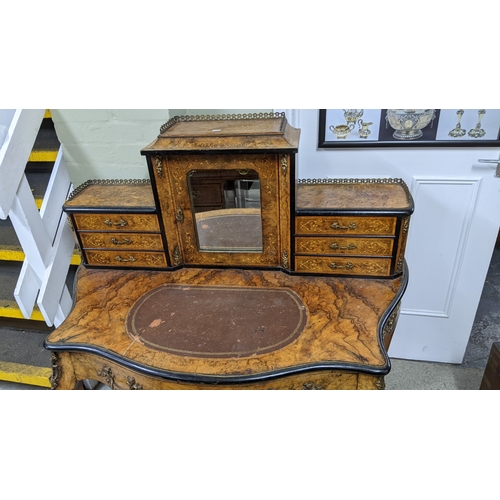 197 - A 19th century French Louis XV style, burr walnut, ebonised and marquetry bonheur-du-jour, with a mi... 