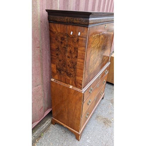 201 - An 18th century and later walnut crossbanded escritoire, having a moulded cornice and fall flap abov... 