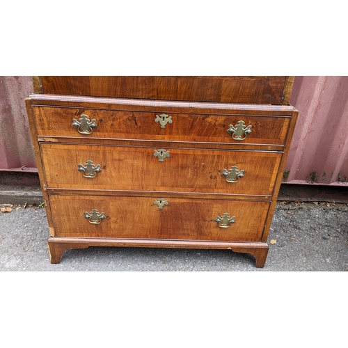 201 - An 18th century and later walnut crossbanded escritoire, having a moulded cornice and fall flap abov... 