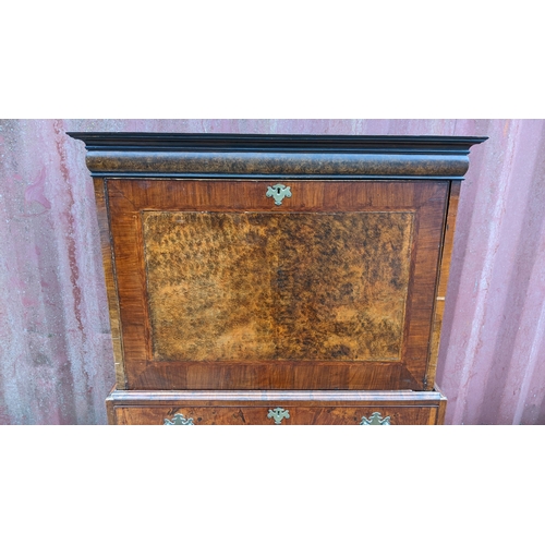 201 - An 18th century and later walnut crossbanded escritoire, having a moulded cornice and fall flap abov... 