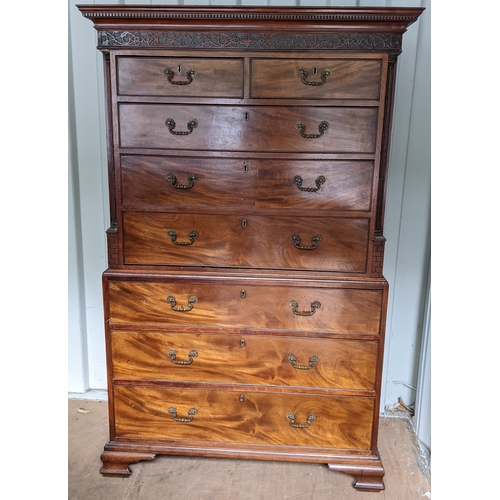 203 - A George III mahogany chest on chest, having a dental moulded corner above scroll fretwork, twin ree... 