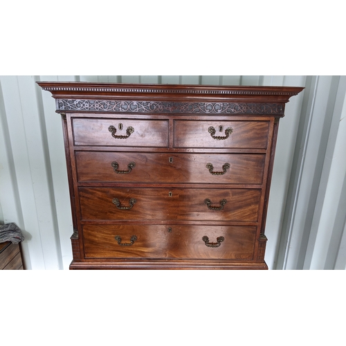 203 - A George III mahogany chest on chest, having a dental moulded corner above scroll fretwork, twin ree... 