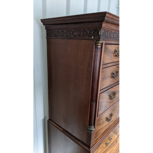 203 - A George III mahogany chest on chest, having a dental moulded corner above scroll fretwork, twin ree... 