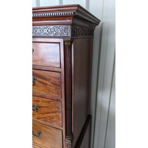 203 - A George III mahogany chest on chest, having a dental moulded corner above scroll fretwork, twin ree... 