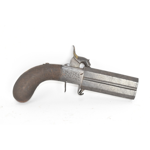 205 - A 19th century English double-barrel pistol, the action engraved with foliate scrollwork and fitted ... 
