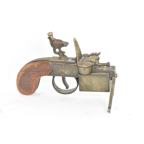 206 - A Dunhill novelty lighter in the form of a flintlock tinderbox, with wooden grips, dummy hammer and ... 