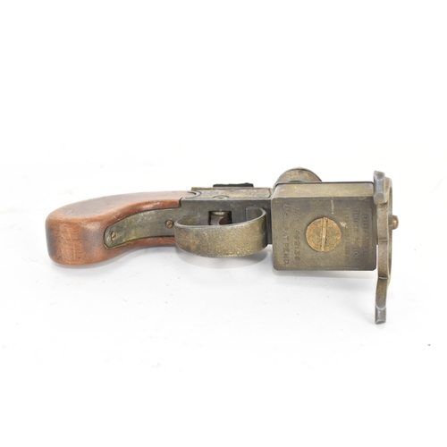 206 - A Dunhill novelty lighter in the form of a flintlock tinderbox, with wooden grips, dummy hammer and ... 