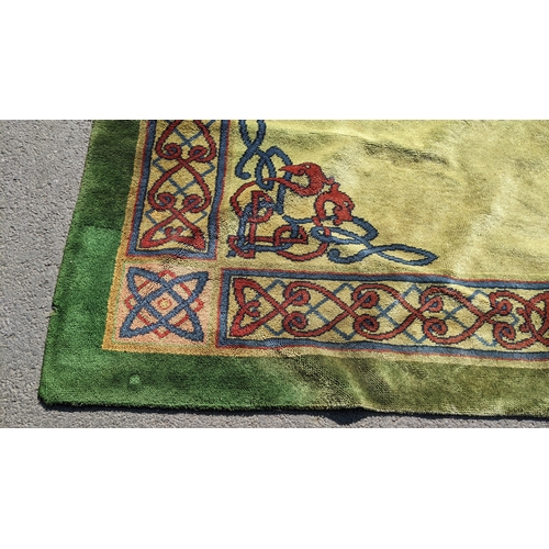 207 - An early 20th century hand-knotted Donegal carpet, the green field centred by a red and blue knotwor... 