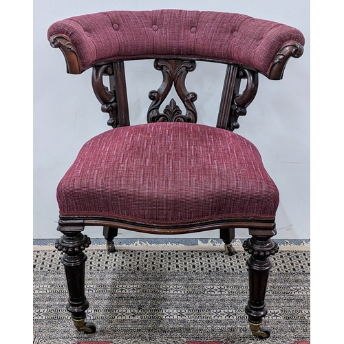 208 - A Victorian mahogany tub chair, with a buttoned curved back and scroll terminals, the pierced splat ... 
