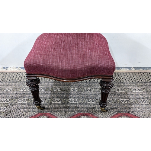 208 - A Victorian mahogany tub chair, with a buttoned curved back and scroll terminals, the pierced splat ... 