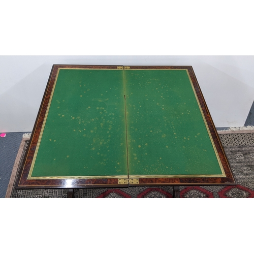 209 - A Gillows Victorian Aesthetic Movement ebonised and amboyna games table, the rectangular hinged top ... 