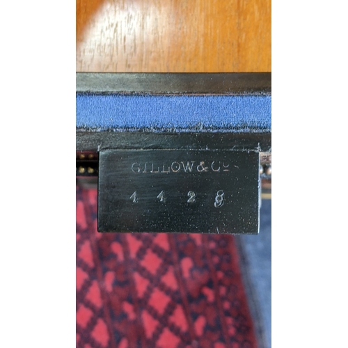 209 - A Gillows Victorian Aesthetic Movement ebonised and amboyna games table, the rectangular hinged top ... 