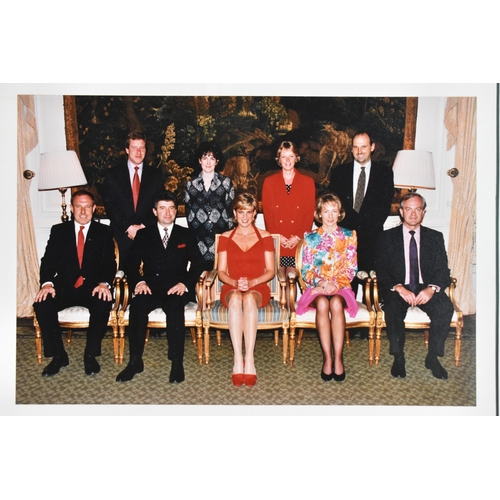 210 - A signed colour group photograph featuring Diana, Princess of Wales seated centrally, with eight oth... 