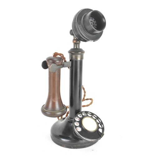 211 - An early 20th century candlestick telephone, model No.150, black lacquered metal and brass, rotary d... 