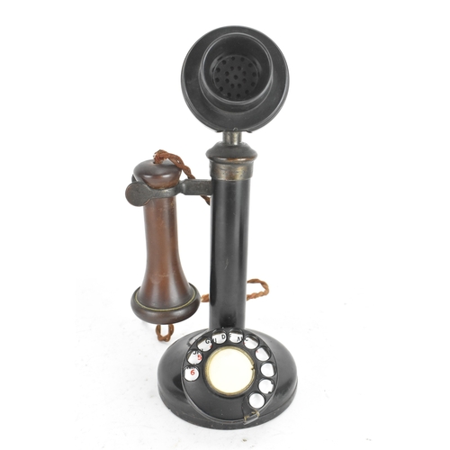 211 - An early 20th century candlestick telephone, model No.150, black lacquered metal and brass, rotary d... 