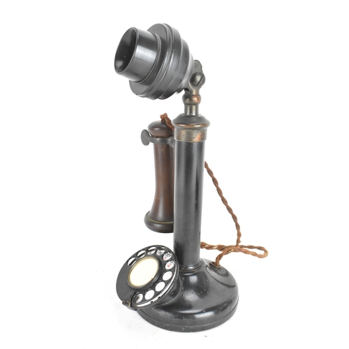 211 - An early 20th century candlestick telephone, model No.150, black lacquered metal and brass, rotary d... 