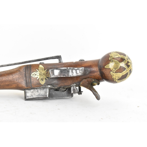 215 - A late 18th/early 19th century Balkan or Ottoman flintlock pistol, with a brass barrel engraved with... 