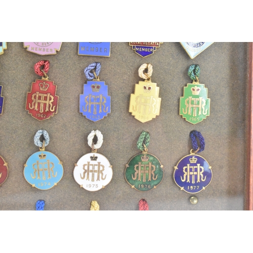 222 - A collection of fifty-six Henley Regatta enamelled badges, dating from 1924-33, 1935-37, 1946-88, ho... 