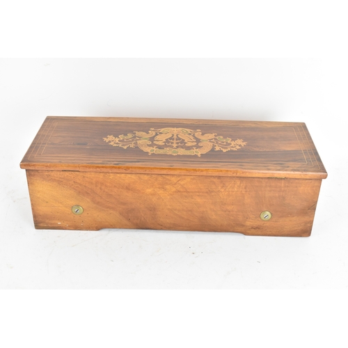 223 - A Victorian rosewood and walnut cased cylinder music box, the hinged rosewood veneered lid with foli... 