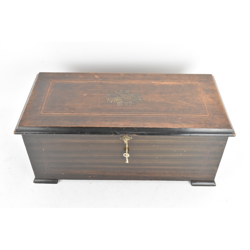 224 - A Victorian ebonized cylinder music box, the rectangular case with line inlay and central motif, enc... 