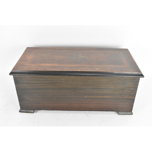 224 - A Victorian ebonized cylinder music box, the rectangular case with line inlay and central motif, enc... 