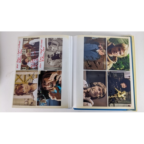 84 - A Doctor Who album of autographs on photos, signed by several cast members to include David Bradley,... 