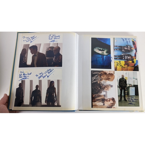 84 - A Doctor Who album of autographs on photos, signed by several cast members to include David Bradley,... 