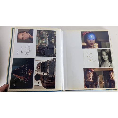 84 - A Doctor Who album of autographs on photos, signed by several cast members to include David Bradley,... 