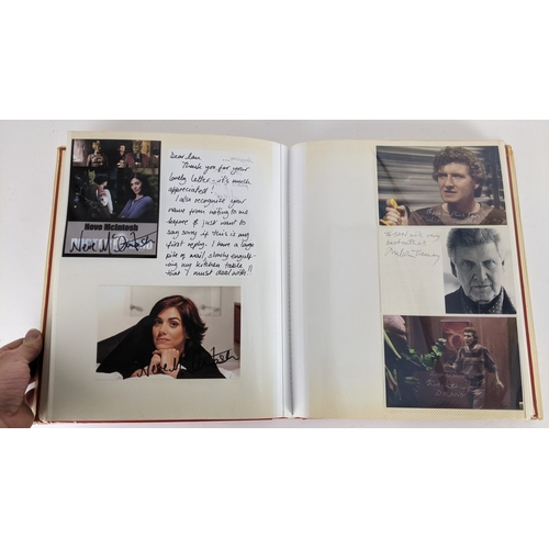 90 - A Doctor Who album of autographs on photos, signed by several cast members to include Tom Baker, Kar... 