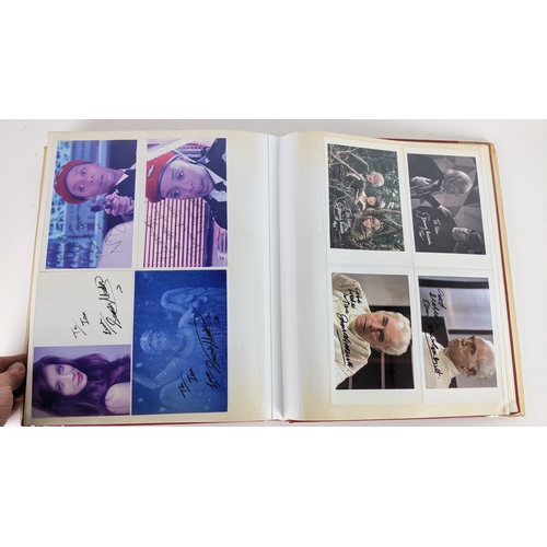90 - A Doctor Who album of autographs on photos, signed by several cast members to include Tom Baker, Kar... 