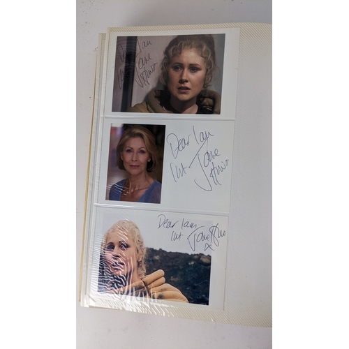 90 - A Doctor Who album of autographs on photos, signed by several cast members to include Tom Baker, Kar... 