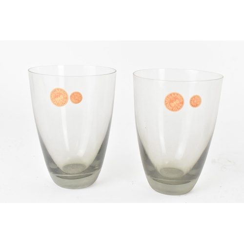 92 - Per Lutken for Holmegaard Glass, a mid-century Roskilde mixer jug and tumbler set in smoke grey tint... 