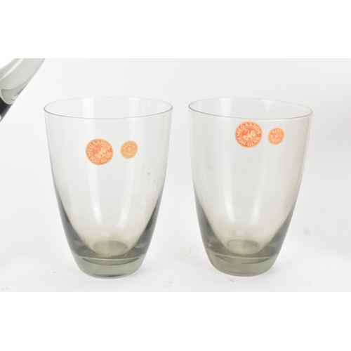 92 - Per Lutken for Holmegaard Glass, a mid-century Roskilde mixer jug and tumbler set in smoke grey tint... 