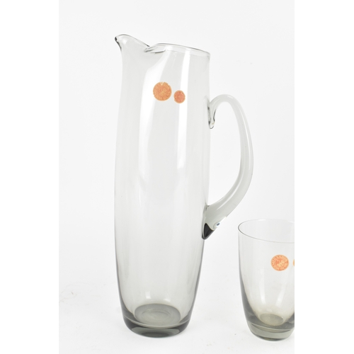 92 - Per Lutken for Holmegaard Glass, a mid-century Roskilde mixer jug and tumbler set in smoke grey tint... 