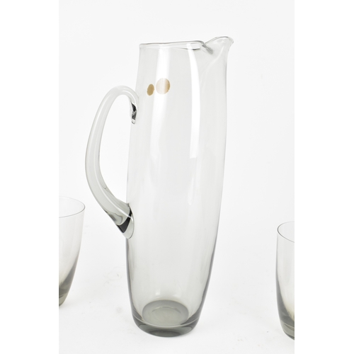 92 - Per Lutken for Holmegaard Glass, a mid-century Roskilde mixer jug and tumbler set in smoke grey tint... 