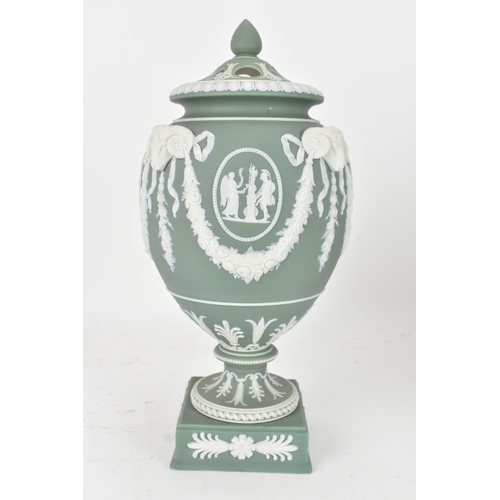 99 - A Wedgwood green jasperware covered pot pourri urn, of ovoid form with domed pierced cover and inner... 