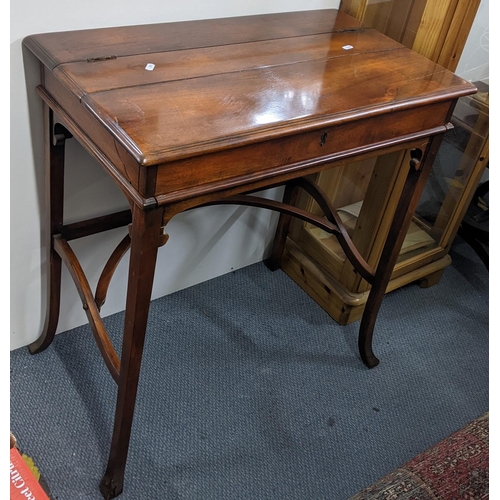 A reproduction mahogany writing / captains table having a fold over top opening to reveal pigeon holes and leather scriber 78cm H x 73.5cm W together with a  Lusty Lloyd Loom pink trunk with a lid upholstered in cream and dark red striped fabric
Location: A4F
If there  is no condition report shown, please request