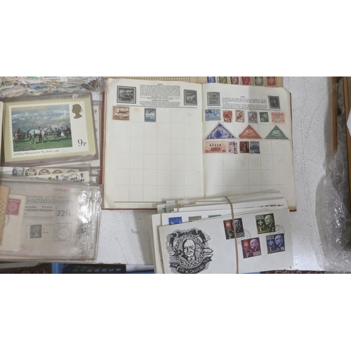 26 - A collection of postage stamps and First Day covers to include examples from China, Germany, Hondura... 