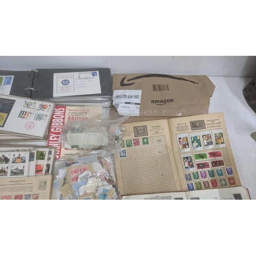 26 - A collection of postage stamps and First Day covers to include examples from China, Germany, Hondura... 