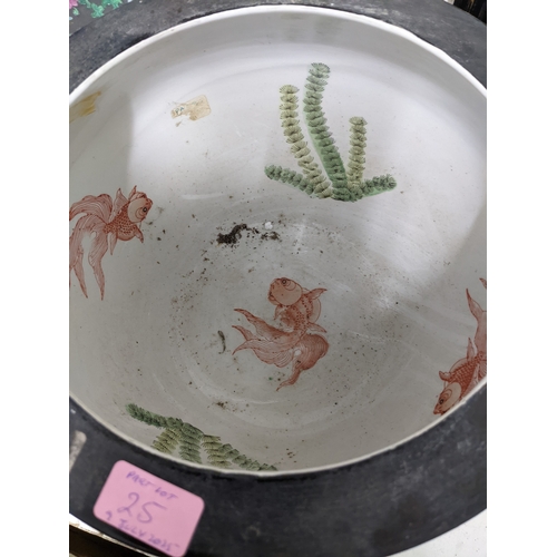 25 - A late 20th century Chinese porcelain garden seat A/F, and a Chinese fish bowl decorated with iris' ... 