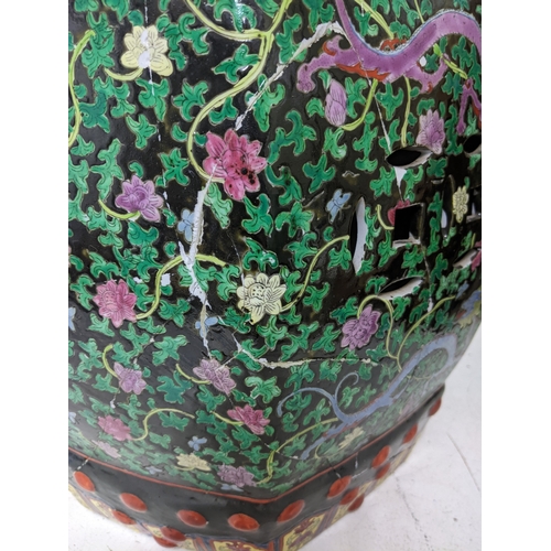 25 - A late 20th century Chinese porcelain garden seat A/F, and a Chinese fish bowl decorated with iris' ... 